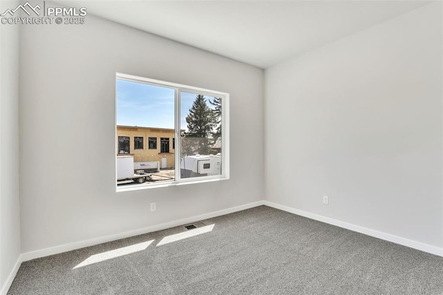241 N Front St Unit 101, Monument, CO 80132 - carpeted empty room with baseboards and visible vents