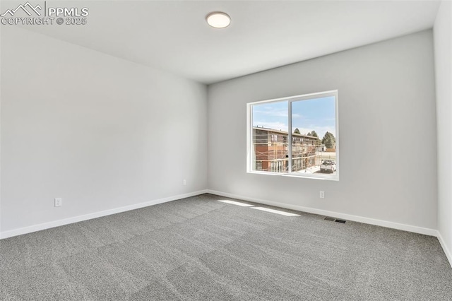 241 N Front St Unit 101, Monument, CO 80132 - carpeted empty room featuring baseboards and visible vents
