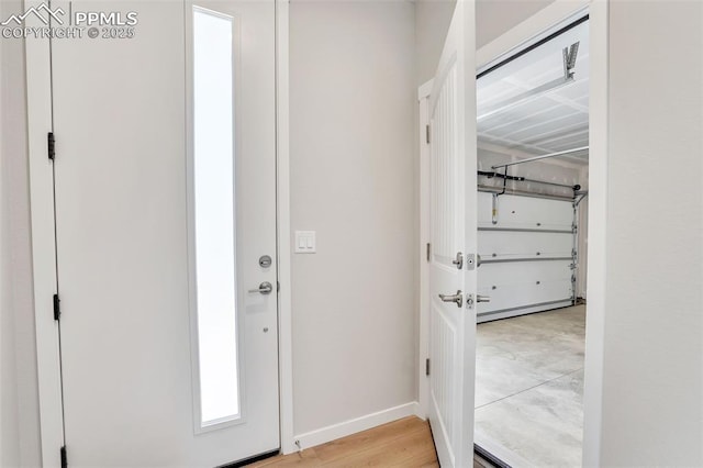 241 N Front St Unit 101, Monument, CO 80132 - foyer entrance featuring light wood-type flooring and baseboards