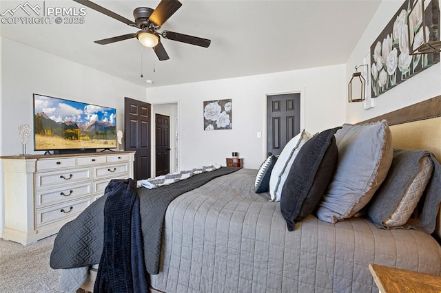 bedroom featuring light carpet and ceiling fan