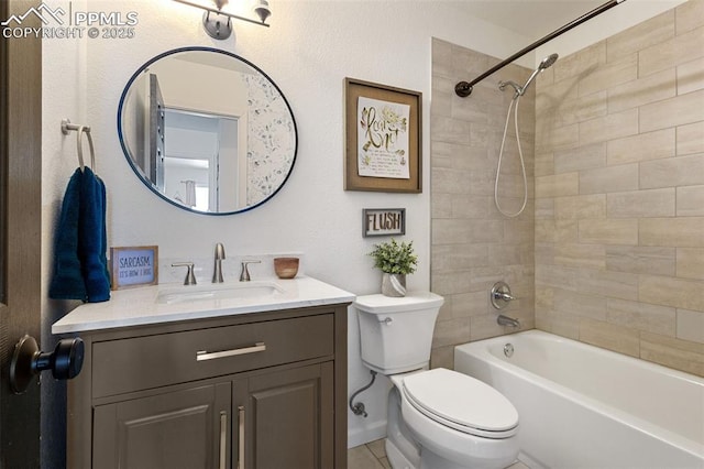 full bathroom featuring vanity, tiled shower / bath, and toilet