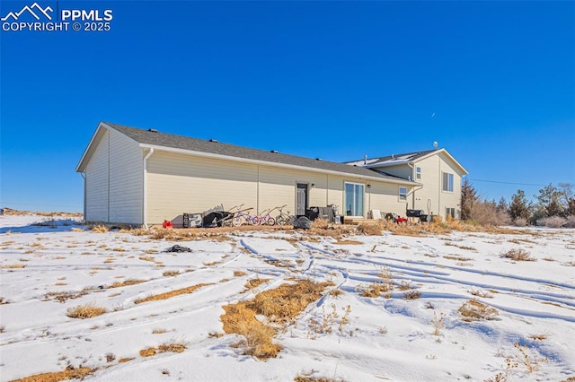 view of snow covered house