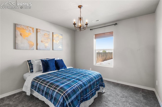 bedroom featuring a notable chandelier and carpet