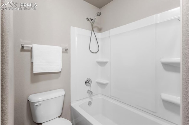 bathroom with shower / tub combination and toilet