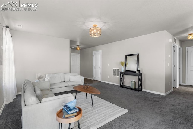 living room featuring dark colored carpet