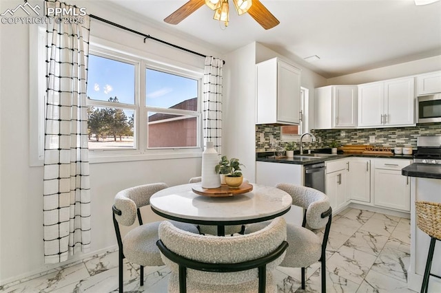 kitchen with white cabinetry, sink, and appliances with stainless steel finishes