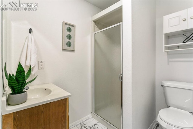 bathroom featuring vanity, toilet, and walk in shower