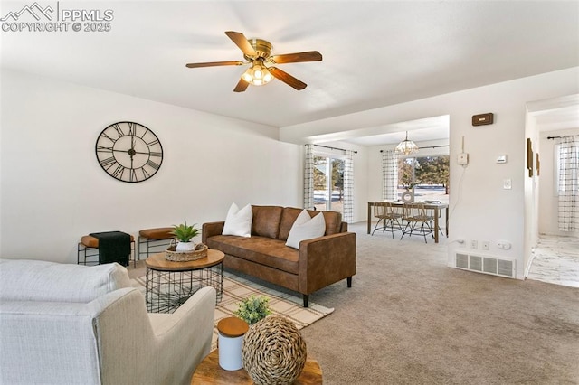 living room featuring ceiling fan and carpet floors