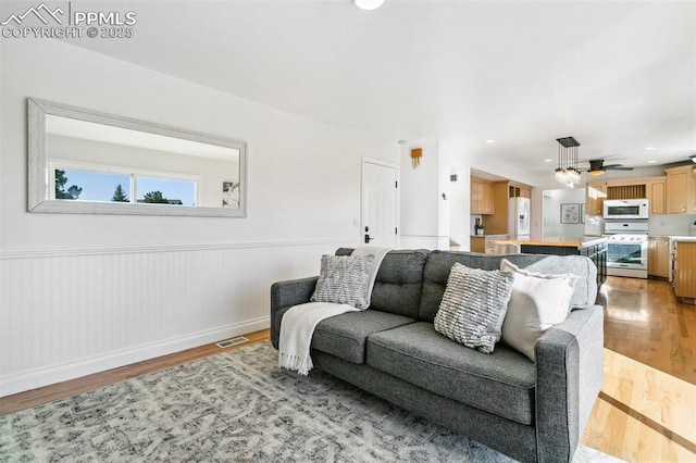 living room with light hardwood / wood-style flooring