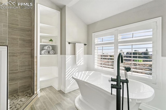 bathroom with lofted ceiling and independent shower and bath