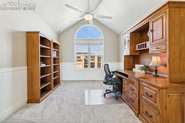 home office with lofted ceiling, light colored carpet, and ceiling fan