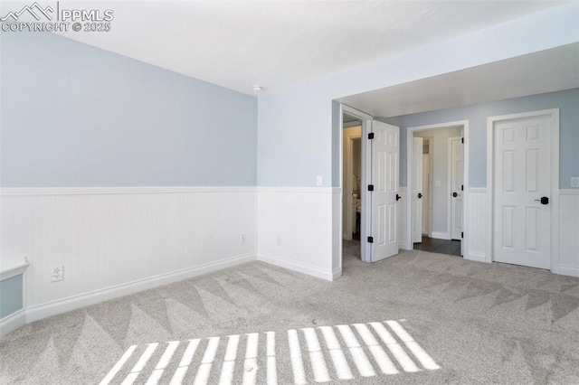 empty room featuring light colored carpet