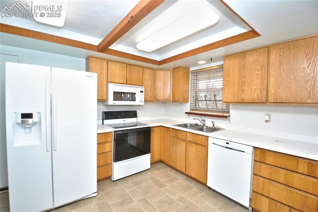 kitchen with tasteful backsplash, sink, and white appliances