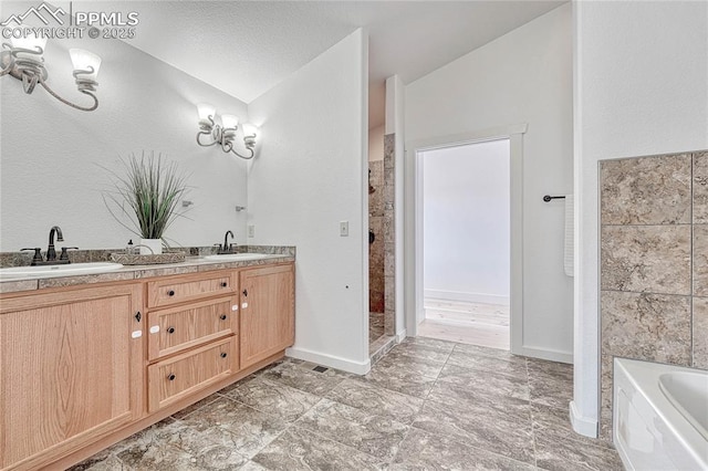 1636 Lakemoor Dr, Florissant, CO 80816 - bathroom featuring double vanity, a sink, tiled shower, and a bathing tub