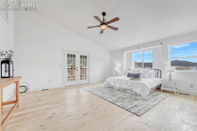 1636 Lakemoor Dr, Florissant, CO 80816 - bedroom featuring high vaulted ceiling, baseboards, access to outside, light wood-type flooring, and french doors