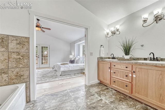1636 Lakemoor Dr, Florissant, CO 80816 - bathroom featuring connected bathroom, lofted ceiling, ceiling fan, and a sink