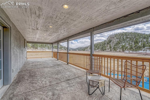1636 Lakemoor Dr, Florissant, CO 80816 - view of patio with a mountain view