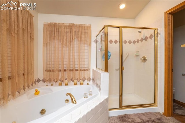 bathroom with toilet and shower with separate bathtub