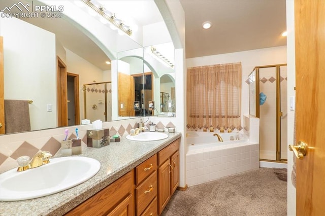 bathroom with vanity and separate shower and tub