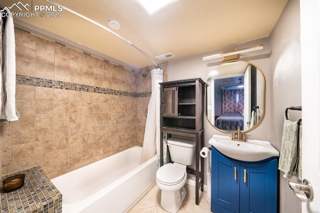 full bathroom with vanity, toilet, tile patterned flooring, and shower / bath combo with shower curtain