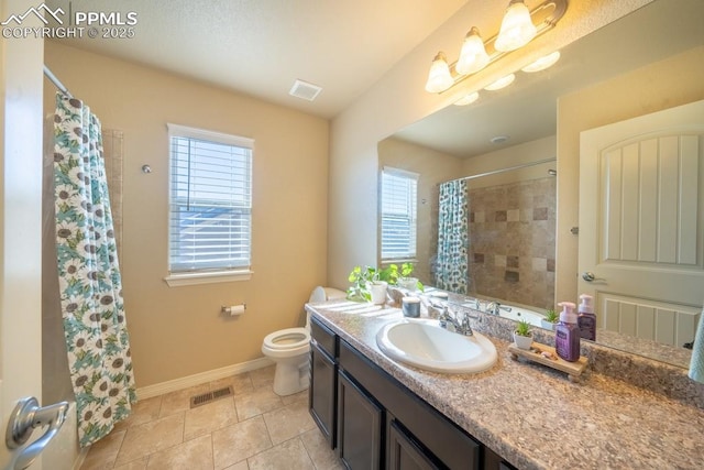 bathroom featuring walk in shower, tile patterned floors, vanity, and toilet