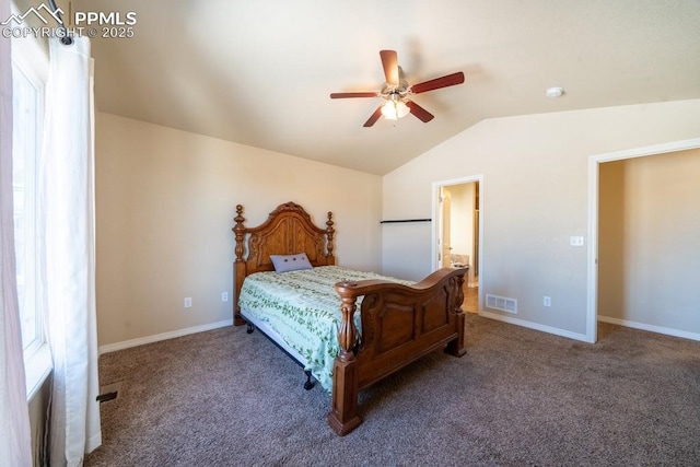 carpeted bedroom with ceiling fan and vaulted ceiling