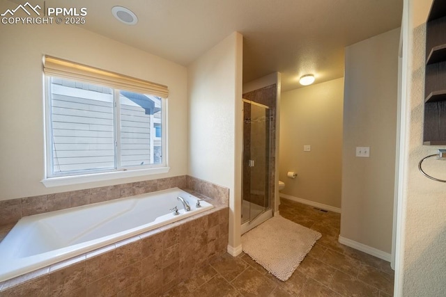 bathroom featuring toilet and plus walk in shower