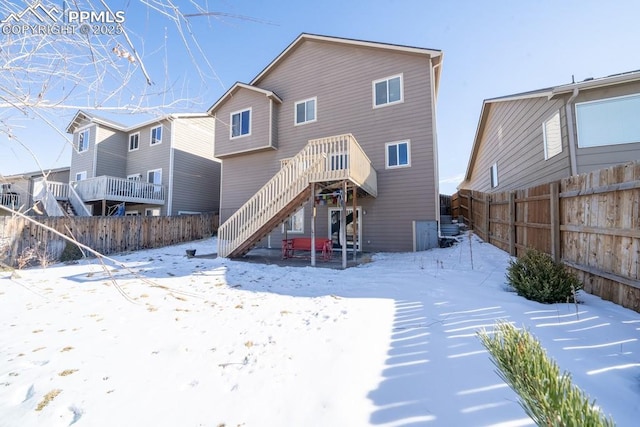 view of snow covered house