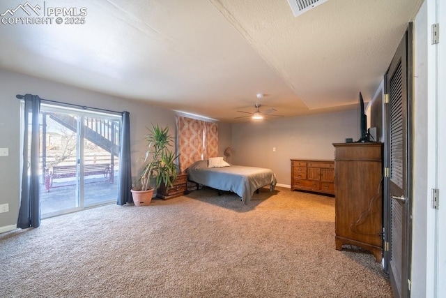 carpeted bedroom with ceiling fan and access to exterior