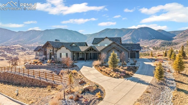 view of front of home featuring a mountain view and a garage