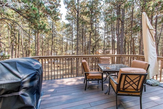 wooden deck with area for grilling