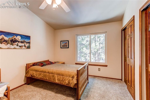 bedroom with vaulted ceiling, light colored carpet, and ceiling fan