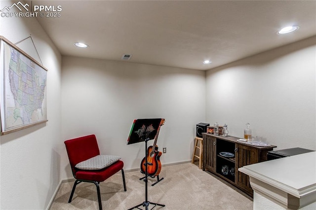 living area with light carpet