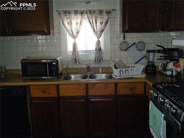 kitchen with tasteful backsplash, dishwasher, light countertops, gas range oven, and a sink