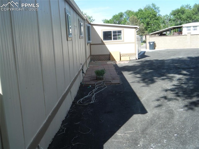 view of home's exterior with fence