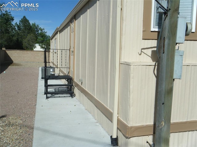 view of home's exterior featuring fence