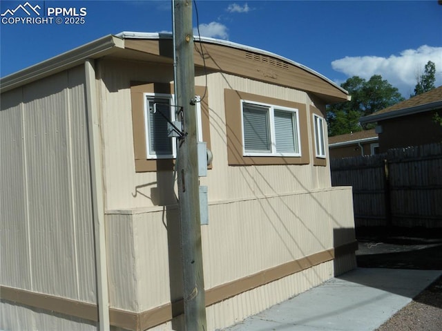 view of home's exterior featuring fence