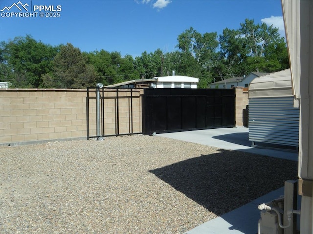 view of yard featuring a gate and fence