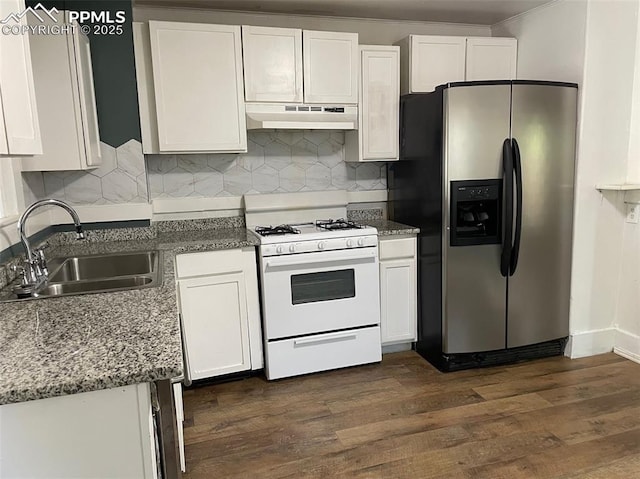 kitchen with white range with gas stovetop, a sink, stainless steel refrigerator with ice dispenser, under cabinet range hood, and white cabinetry