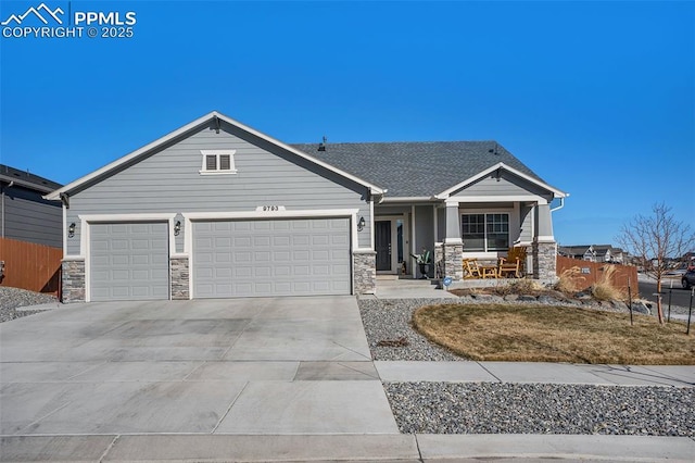 view of front of property featuring a garage and covered porch