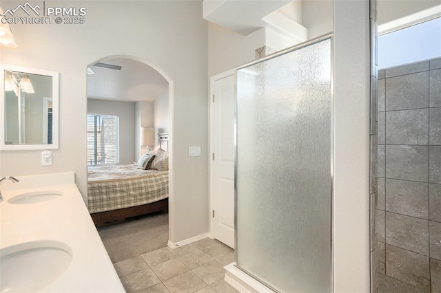 bathroom featuring sink, tile patterned floors, and walk in shower