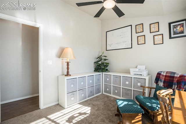 living area with vaulted ceiling, ceiling fan, and carpet