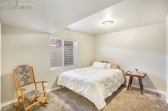 bedroom featuring light carpet