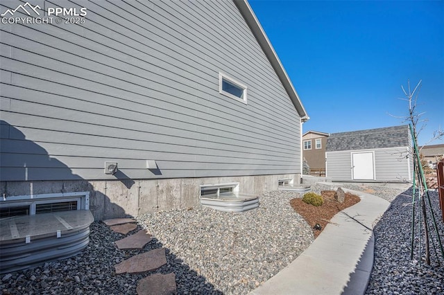 view of side of property with a storage shed