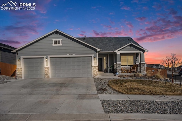 view of front of property featuring a garage and covered porch