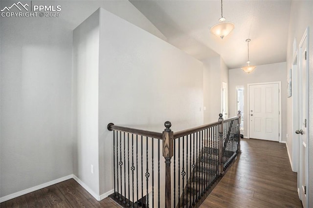 hallway with dark hardwood / wood-style flooring