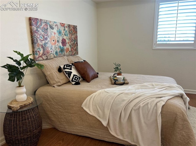 bedroom featuring hardwood / wood-style flooring