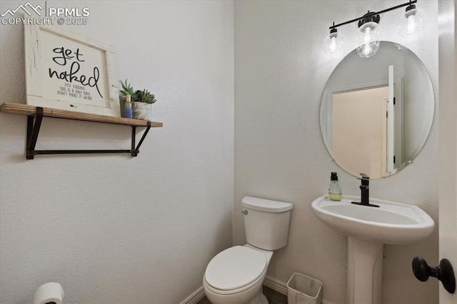 bathroom with sink and toilet