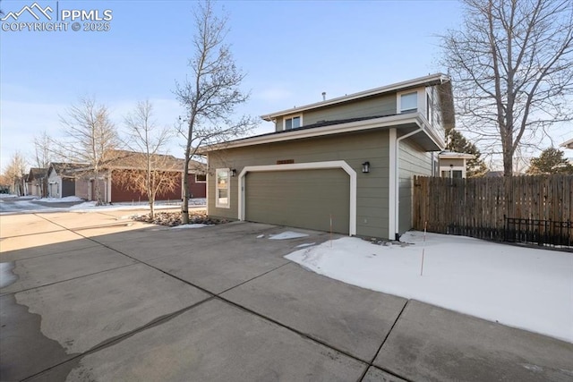 view of side of property with a garage