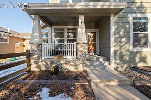 doorway to property featuring a porch